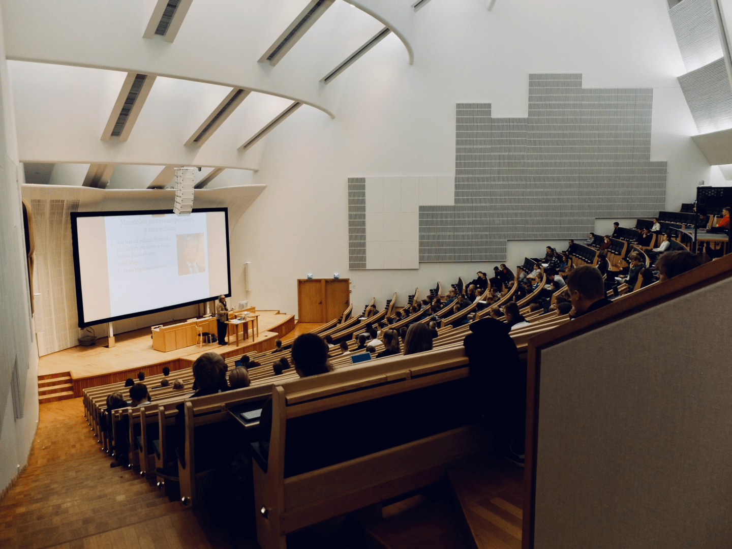 Group of people sitting in a large room