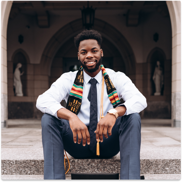 A person sitting down smiling